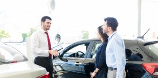 Honda dealerships in Kansas City Couple Listening To Car Salesman With Trust