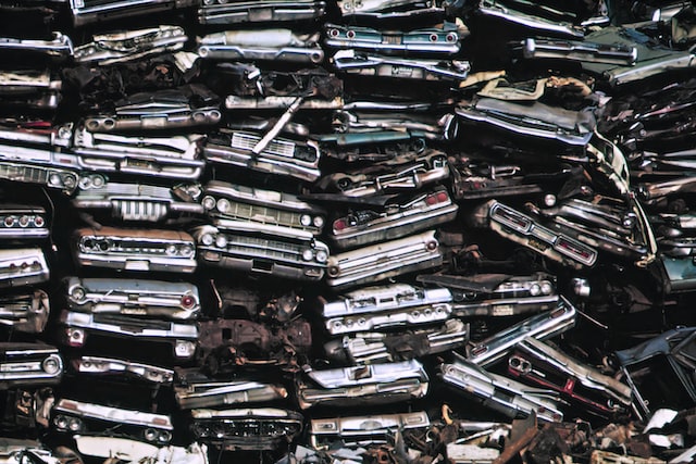 stacked cars in a junkyard