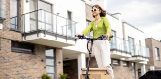 Can an electric scooter replace a car? a girl on an electric scooter carries boxes