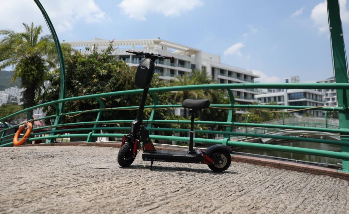 isinwheel scooter near green fence