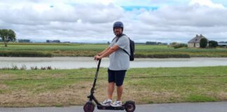 Top Scooter Due To Its Qualities person riding on isinwheel scooter