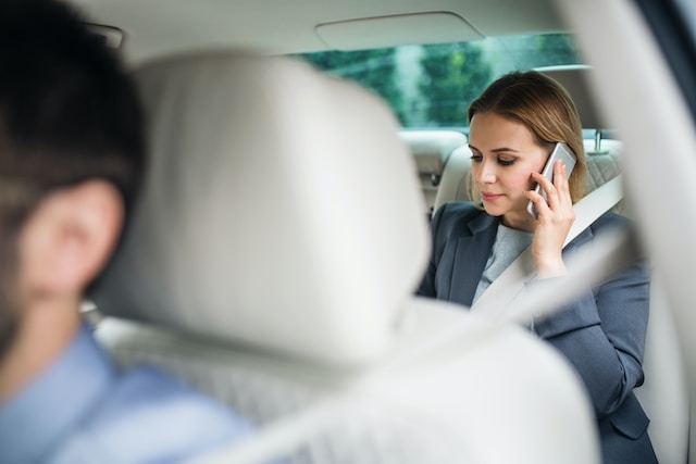 woman as a passenger speaking by the phone