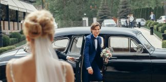 Compare Wedding Cars: Rolls Royce Phantom vs Classic Wedding Cars person getting out from a wedding car