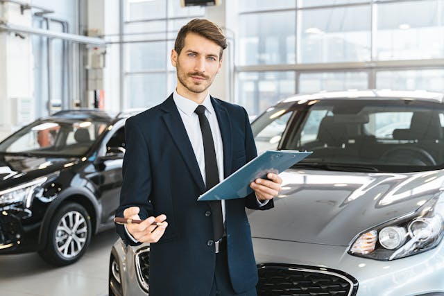 man-in-blue-business-suit-holding-blue-folder