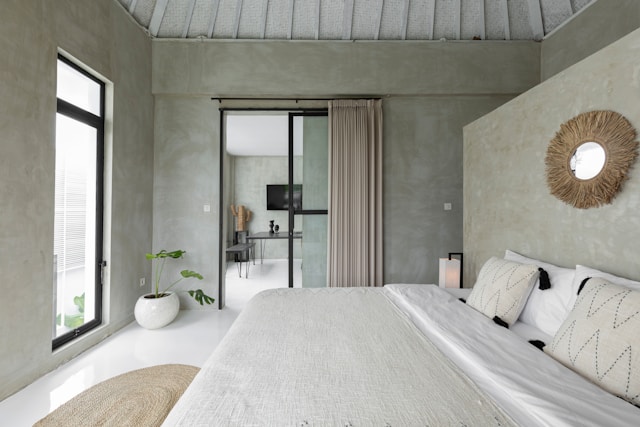 white-bed-near-glass-sliding-door