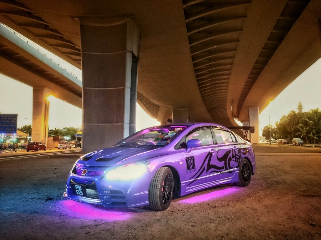 a-purple-car-parked-under-a-bridge a-purple-car-parked-under-a-bridge