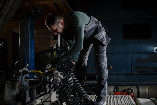 man-repairing-a-truck-in-a-car-service-shop