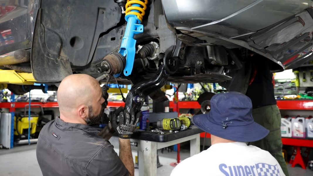 two-men-working-on-a-car-in-a-garage https://classic-cars-welcome.co.uk/brake-banjo-bolts-m10-banjo-bolts-custom-hoses