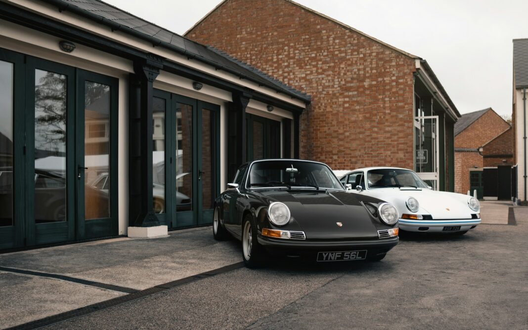 a-couple-of-cars-parked-in-front-of-a-building a-couple-of-cars-parked-in-front-of-a-building